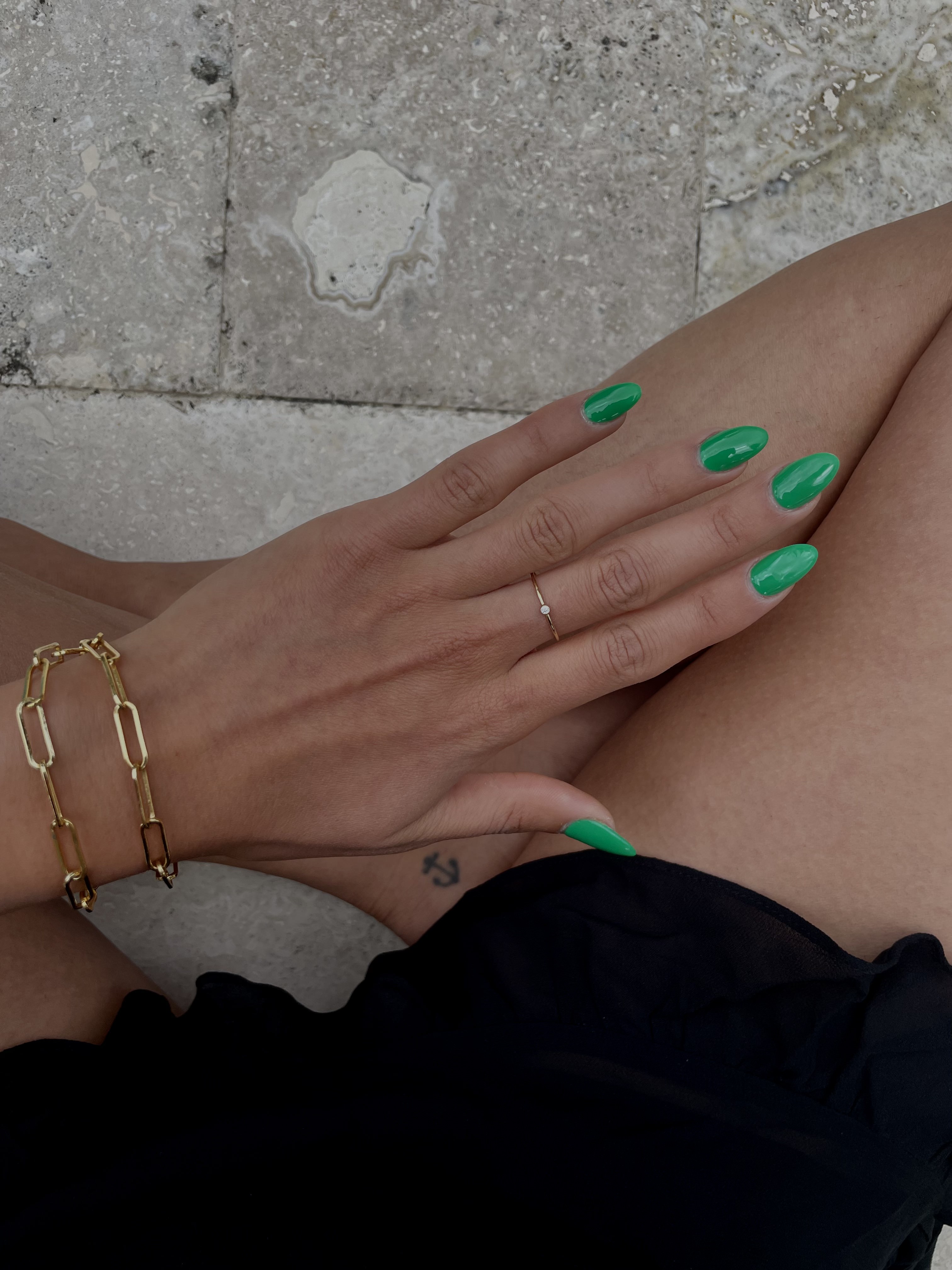 neon green dip nails almond shaped nails summer nail trend gold chain bracelet moody photo